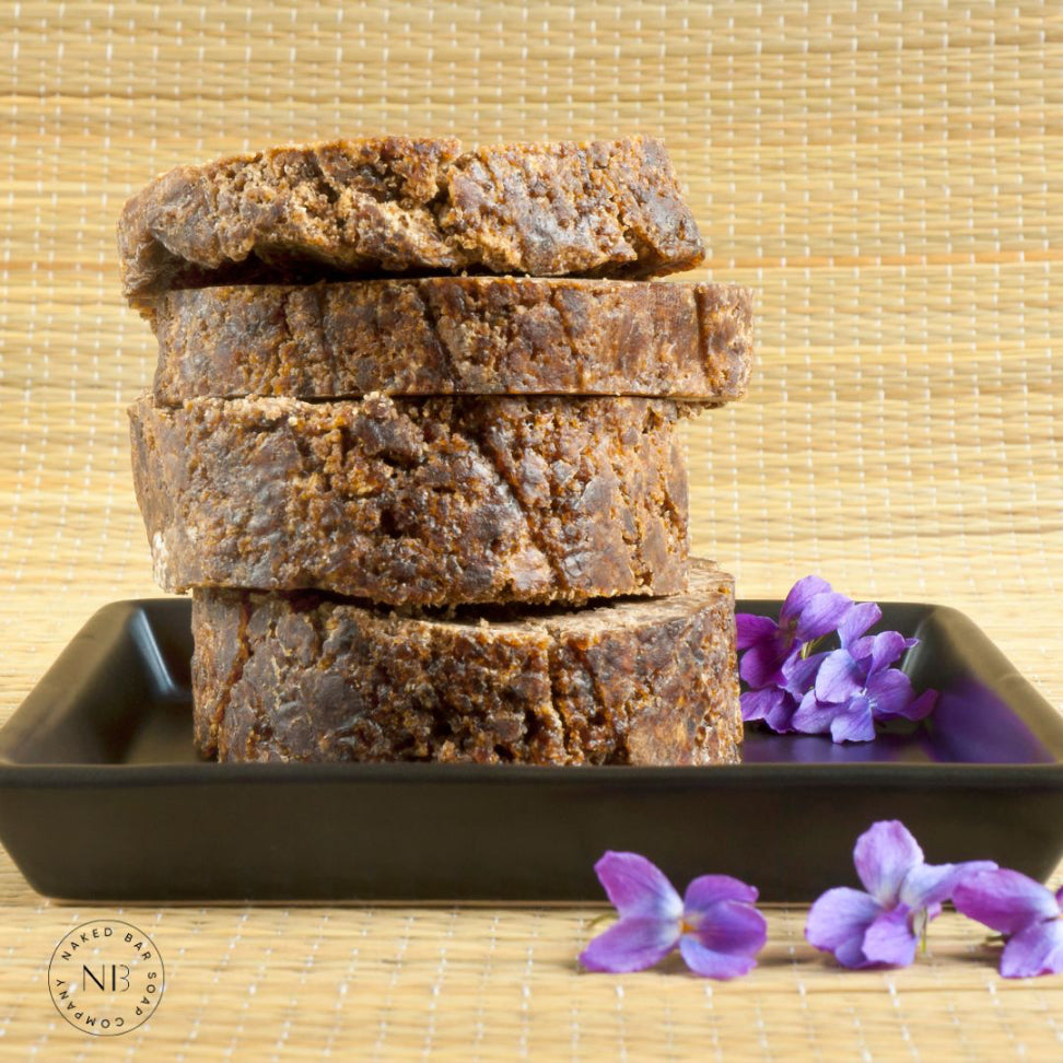 Raw African Black Soap Bar for deep cleansing and even skin tone, natural detoxifying handmade soap suitable for all skin types.